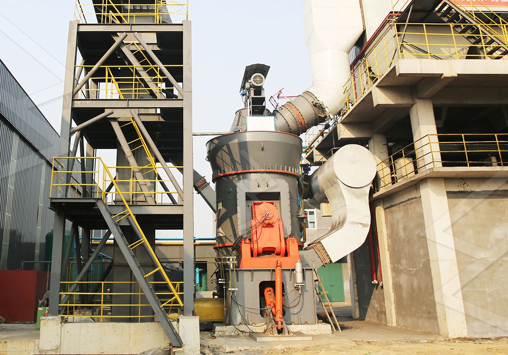 Operator monitoring vertical mill parameters in modern control room