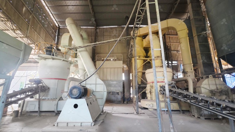 Worker inspecting Raymond mill spare parts