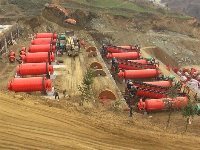 Industrial iron ore grinding machine running on electricity in a factory